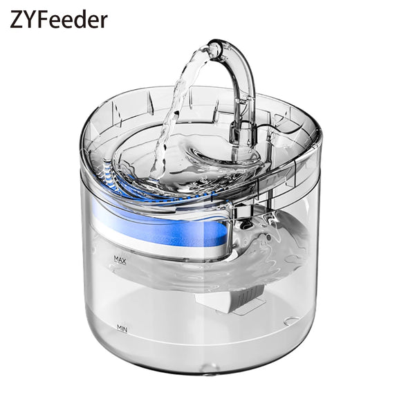 A clear pet water fountain is shown with water flowing, featuring a blue filter component.