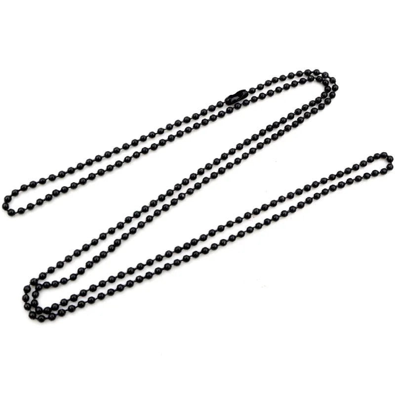 A set of gold and silver plated ball necklaces laid out on a white background.