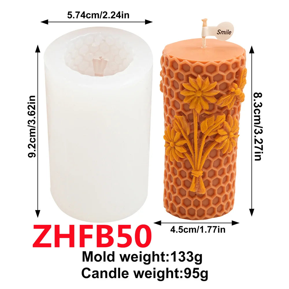 A white pillar candle in a honeycomb silicone mold with an orange floral design.