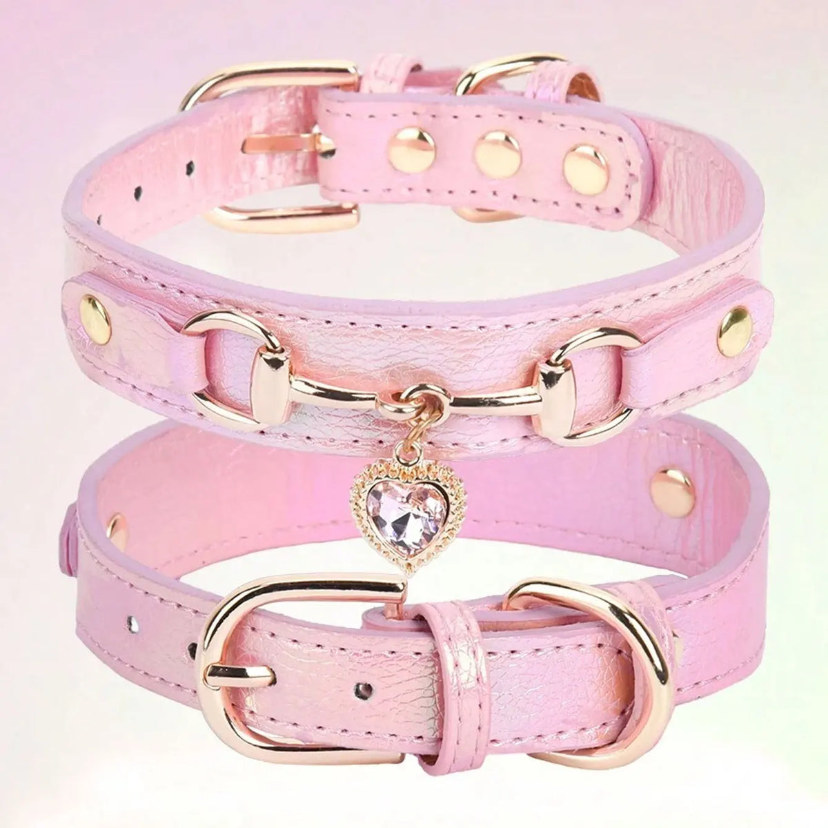 A pink gemstone-embellished PU leather dog collar with gold hardware.