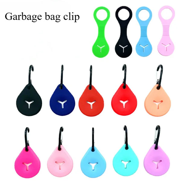 A collection of various colored garbage bag clips for dog poop bags.