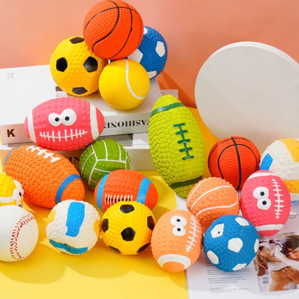 A collection of colorful squeaky latex balls for dogs, including orange, yellow, green, and blue varieties.