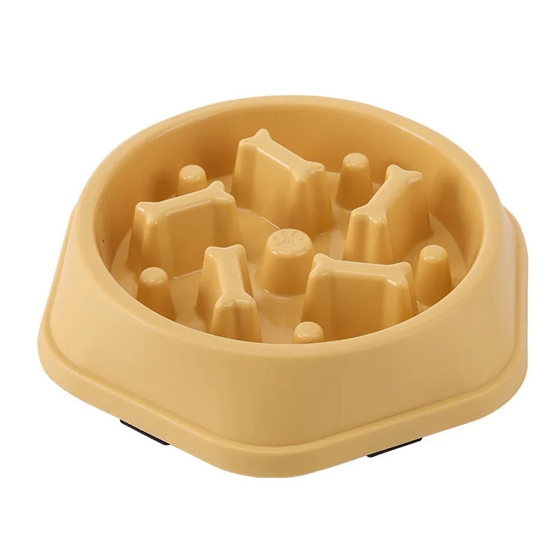 A light beige slow feeder dog bowl with raised ridges and an anti-slip base.