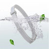 A white adjustable silicone pet collar is shown being splashed by water, with a green leaf floating nearby.