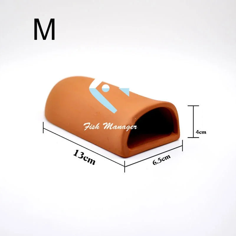 A terracotta-colored ceramic fish manager or shrimp shelter with dimensions 13cm long and 4cm high.