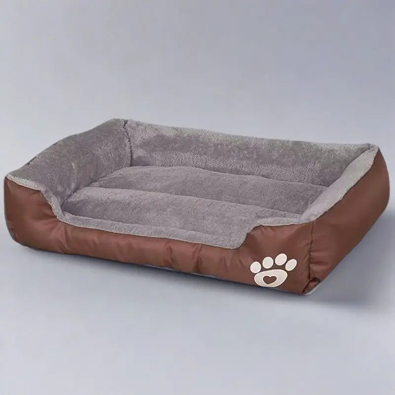 A brown dog bed with a gray plush cushion and a paw print design.