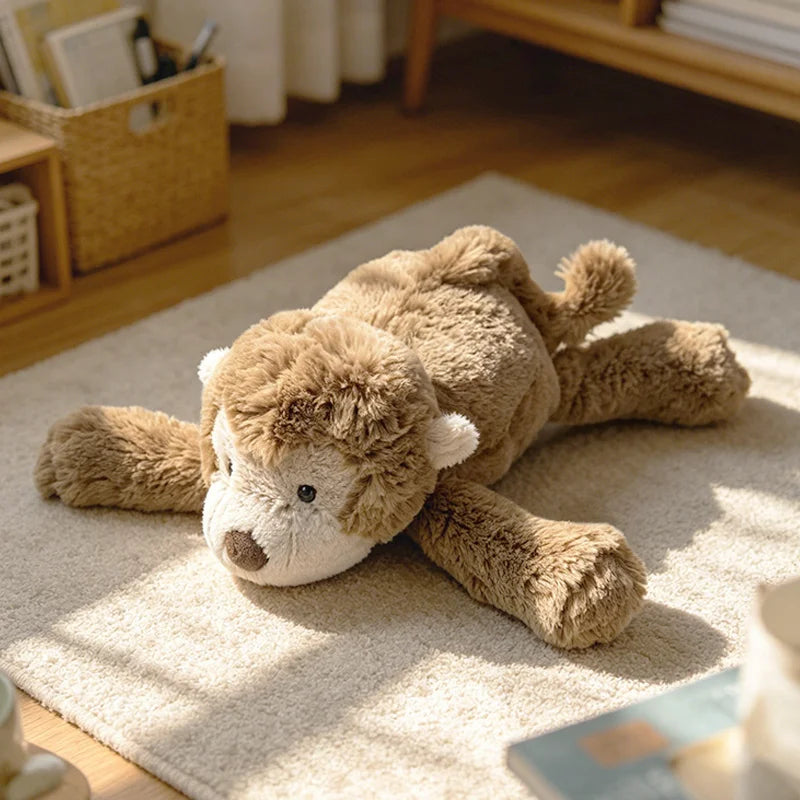 A light brown elephant monkey plush toy lying on a beige rug in a sunlit indoor setting.