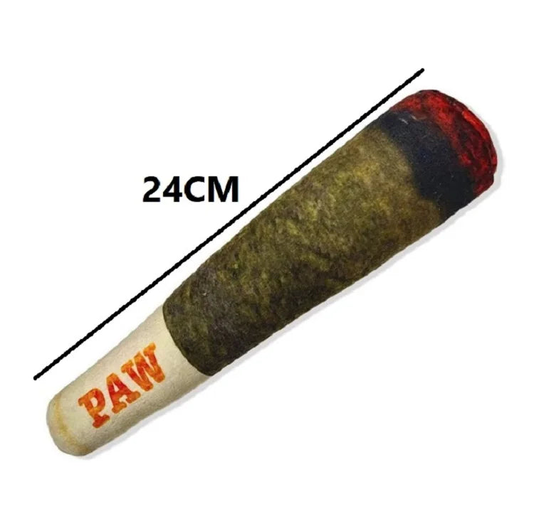 A long, cylindrical plush dog toy with a dark green body and red tip, marked with the text PAW.
