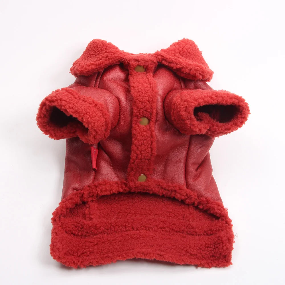 A red faux leather dog coat with a thick, fluffy red fleece lining.