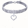 A silver rhinestone collar with a heart pendant for dogs and cats.