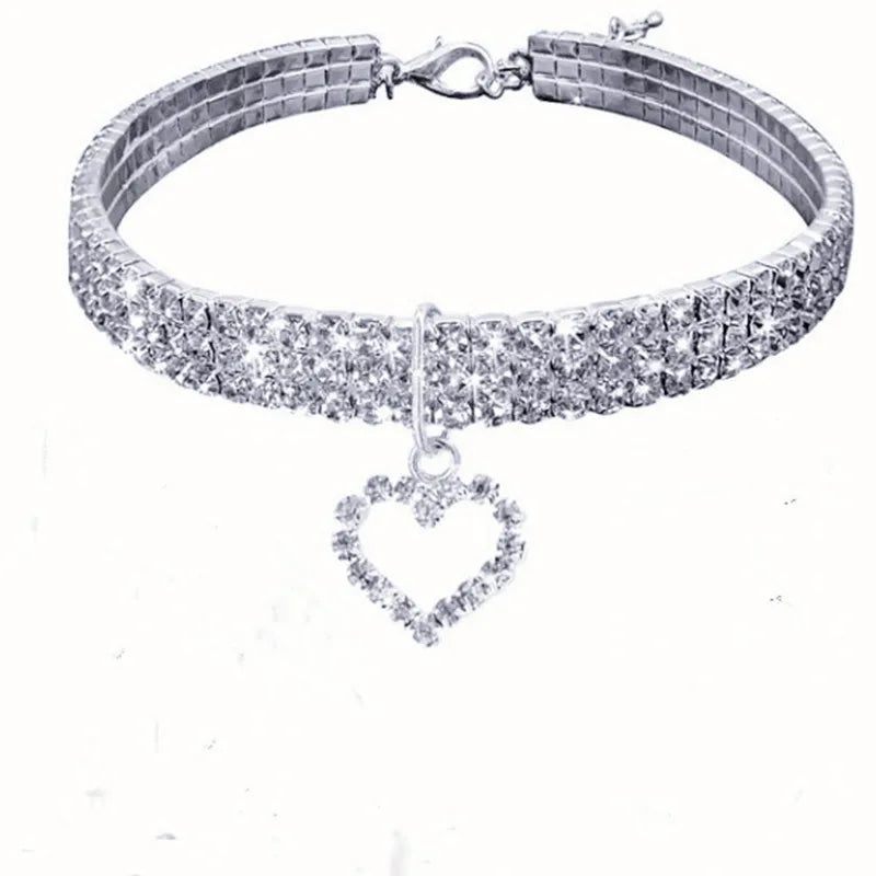 A silver rhinestone collar with a heart pendant for dogs and cats.