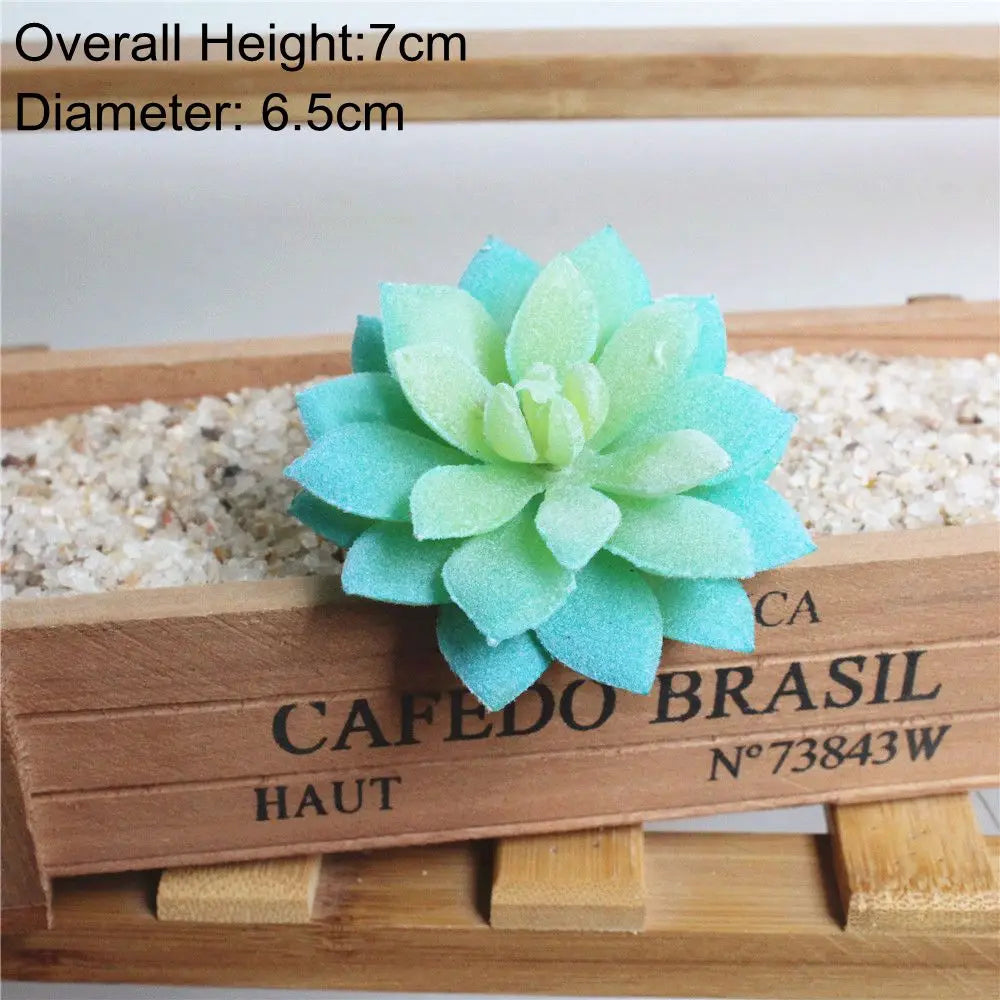 A light blue artificial succulent plant with a rosette shape is displayed on a wooden tray.