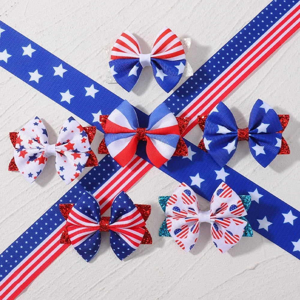 Two pairs of patriotic red white and blue ribbon hair bows with clips featuring stars and stripes