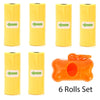 A set of six yellow rolls of reusable pet poop bags with green arrows, including an orange leash clip.