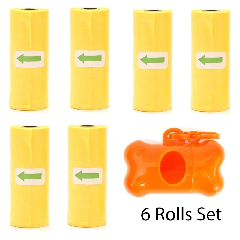 A set of six yellow rolls of reusable pet poop bags with green arrows, including an orange leash clip.