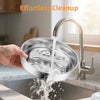 A hand is pouring water into a stainless steel dog bowl using a kitchen faucet.