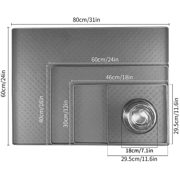 A rectangular gray silicone pet feeding mat with various sized compartments and a bowl section.
