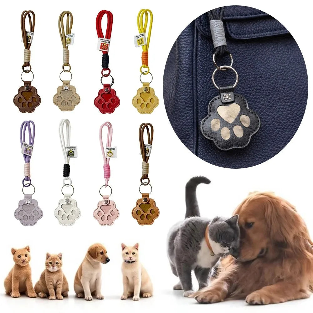 A collection of refillable pet hair keychains featuring various paw charms and a dog resting next to a cat.