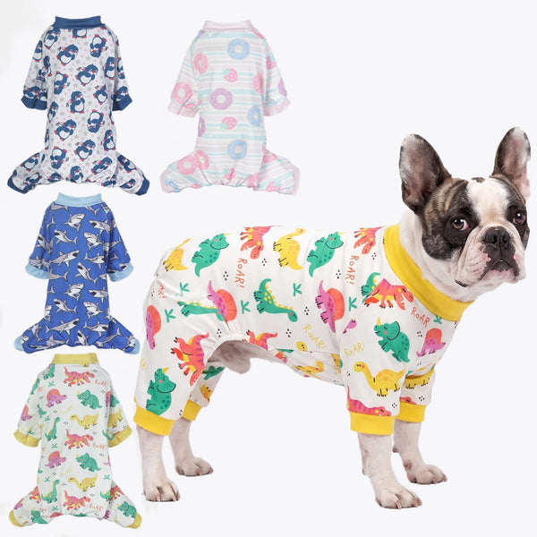 A fawn-colored dog wearing a colorful animal print jumpsuit onesie for small breeds.