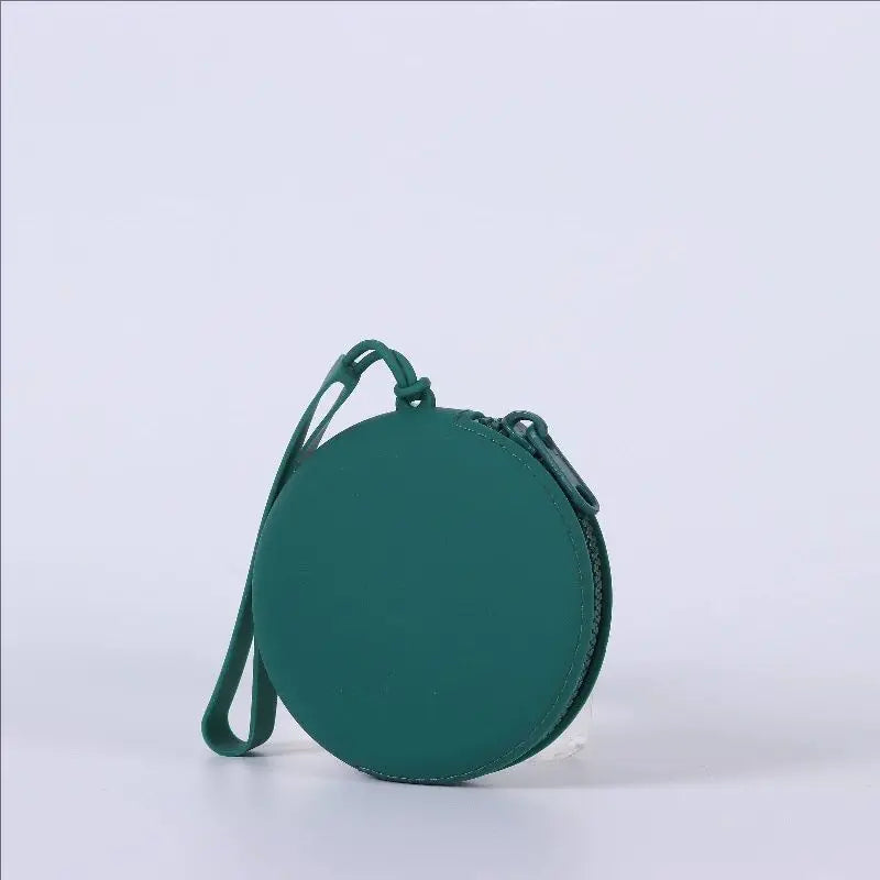 A dark teal silicone pet treat pouch with a zipper is shown against a white background.