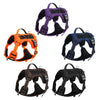 Four purple, orange, blue, and black adjustable no-pull tactical dog harnesses displayed against a white background.