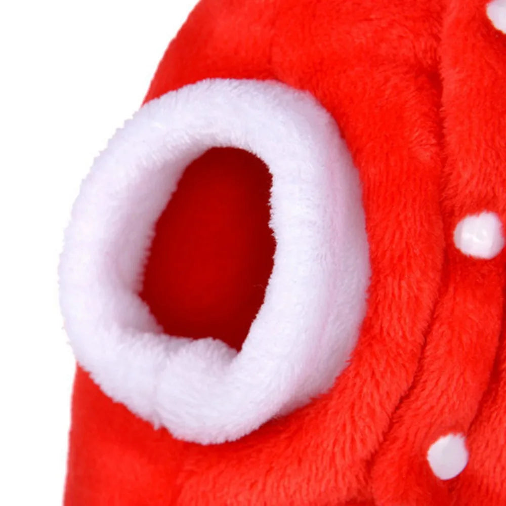 Close-up of a red fleece dog sweater with a white ear detail and small white spots.