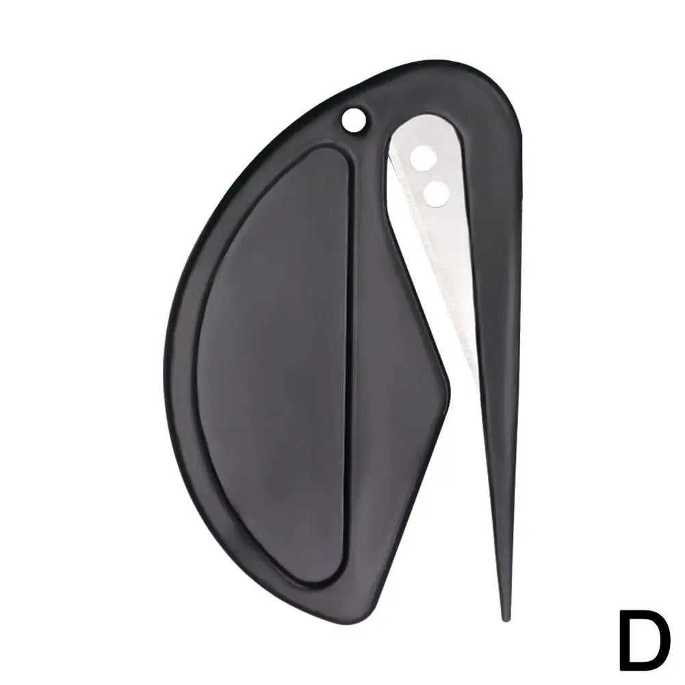 A black pet knotting comb with a curved handle and a white cleaning tip.