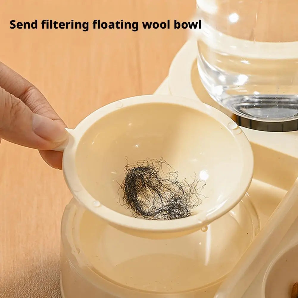 A hand is holding a ceramic floating wool bowl inside a gravity-fed pet food dispenser.