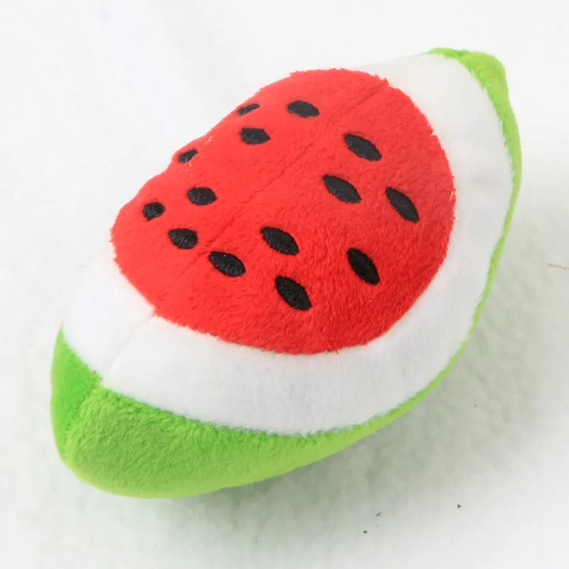 A bone-shaped squeaky plush dog toy for chewers, featuring red and green fabric.