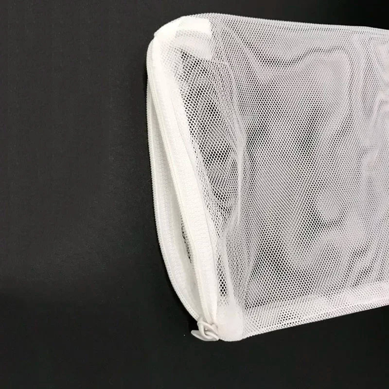 White mesh bags containing aquarium filter media.