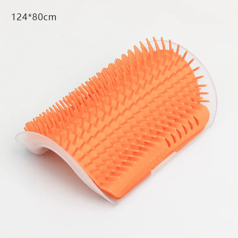 Orange silicone massage brush for hair removal with a white handle and self-cleaning feature