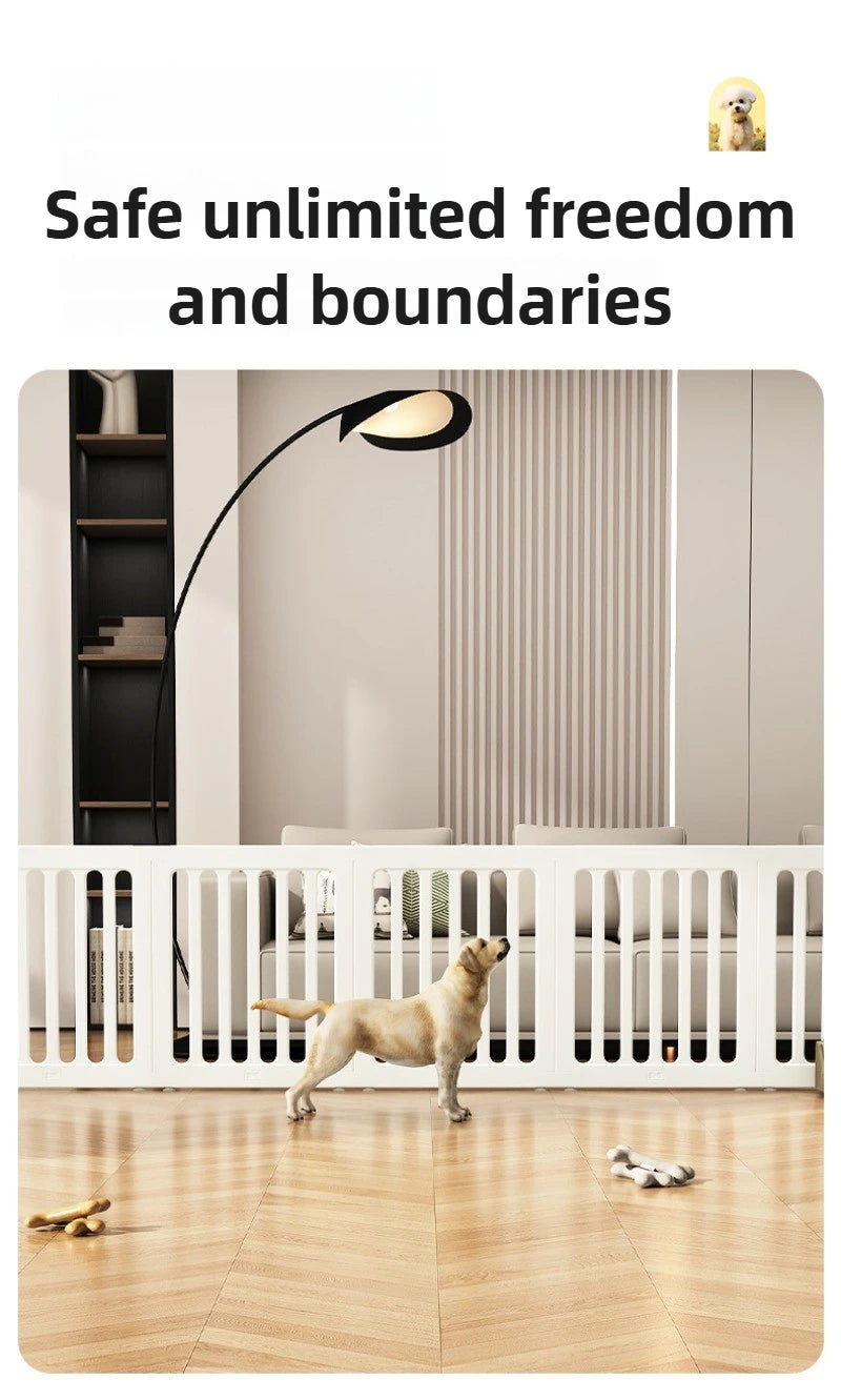 A light tan dog stands inside a white indoor pet playpen with vertical slats on a wooden floor.