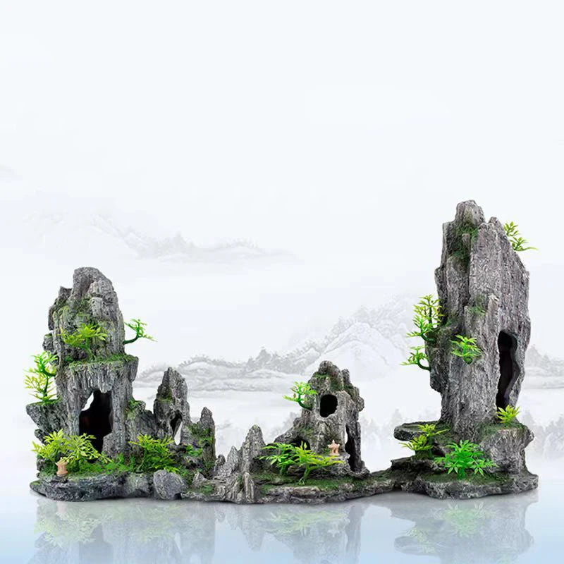 Resin aquarium rockery featuring a landscape of rocks, caves, and small trees.