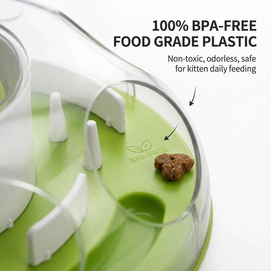 A clear food grade plastic puzzle feeder bowl with a green base and white feeding components for daily pet feeding.
