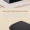 A close-up view of a black memory foam pet ramp for dogs and cats with a textured surface.