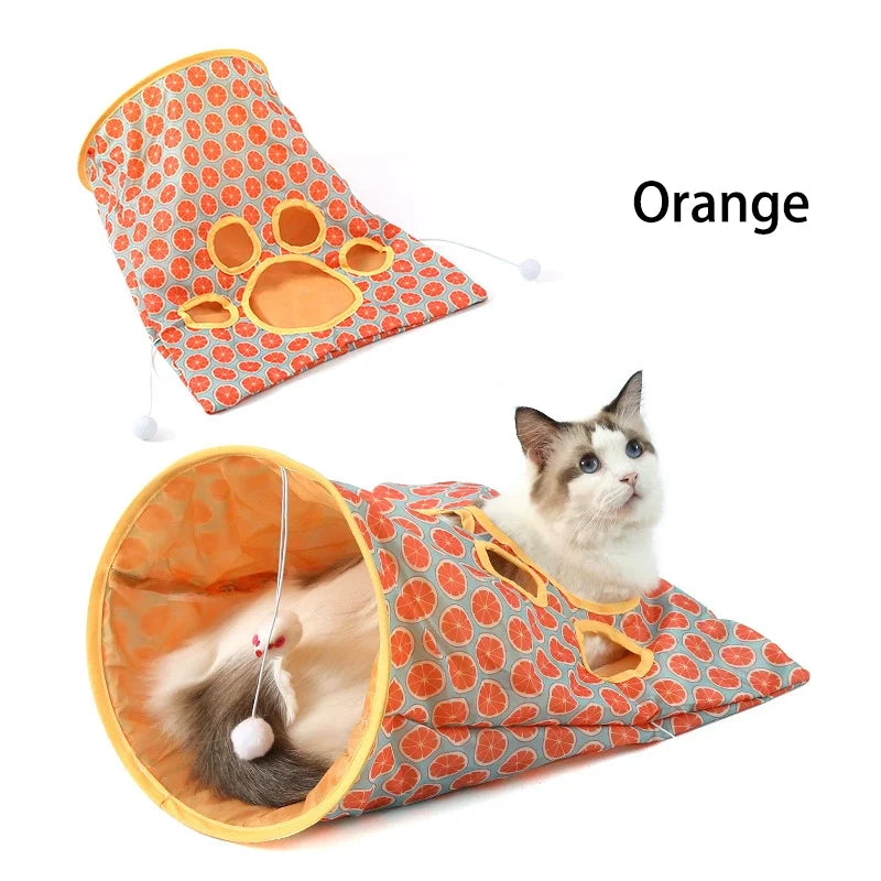 Orange crinkle cat tunnel with a cat inside, showing its use as an interactive hideout.