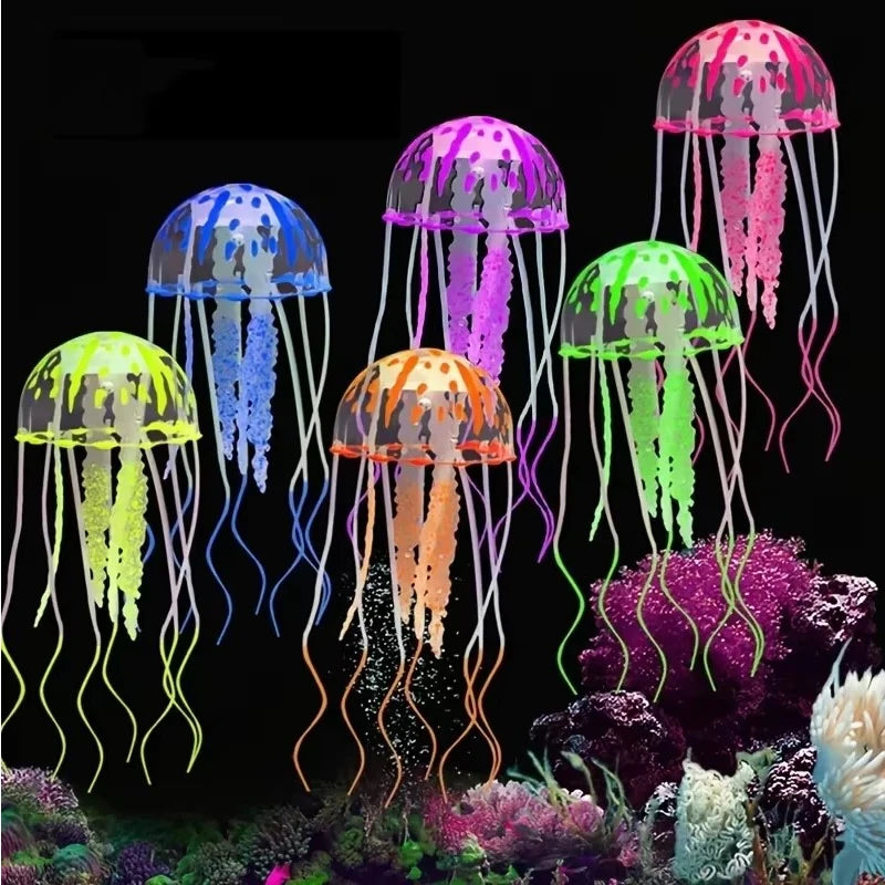 Colorful fluorescent jellyfish aquarium ornaments with trailing tentacles displayed against a dark background.