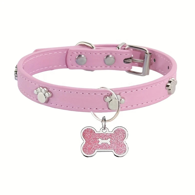 Pink leather pet collar with a silver buckle and a bone-shaped paw print tag.