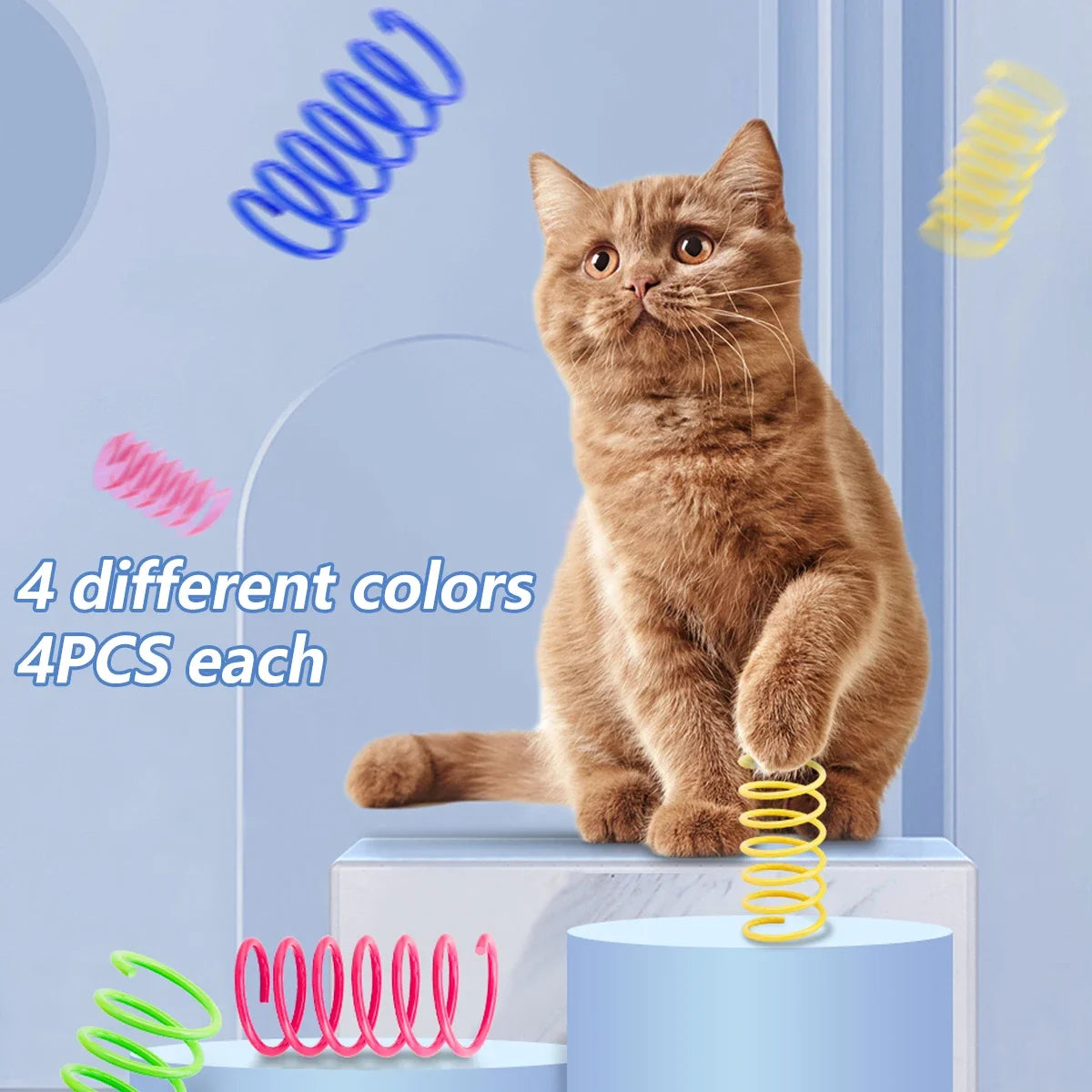 A fluffy brown cat is sitting next to various colorful spring toys for interactive play.