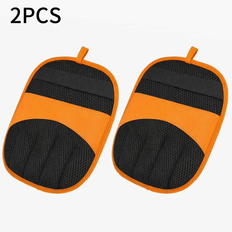 A pair of orange and black reusable pet hair removal gloves.