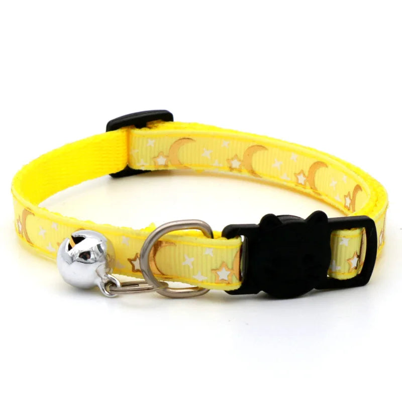 Yellow adjustable pet collar with a black buckle and silver bell necklace