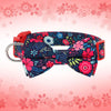 A floral nylon dog collar featuring a pink and blue patterned bowknot against a light pink background.