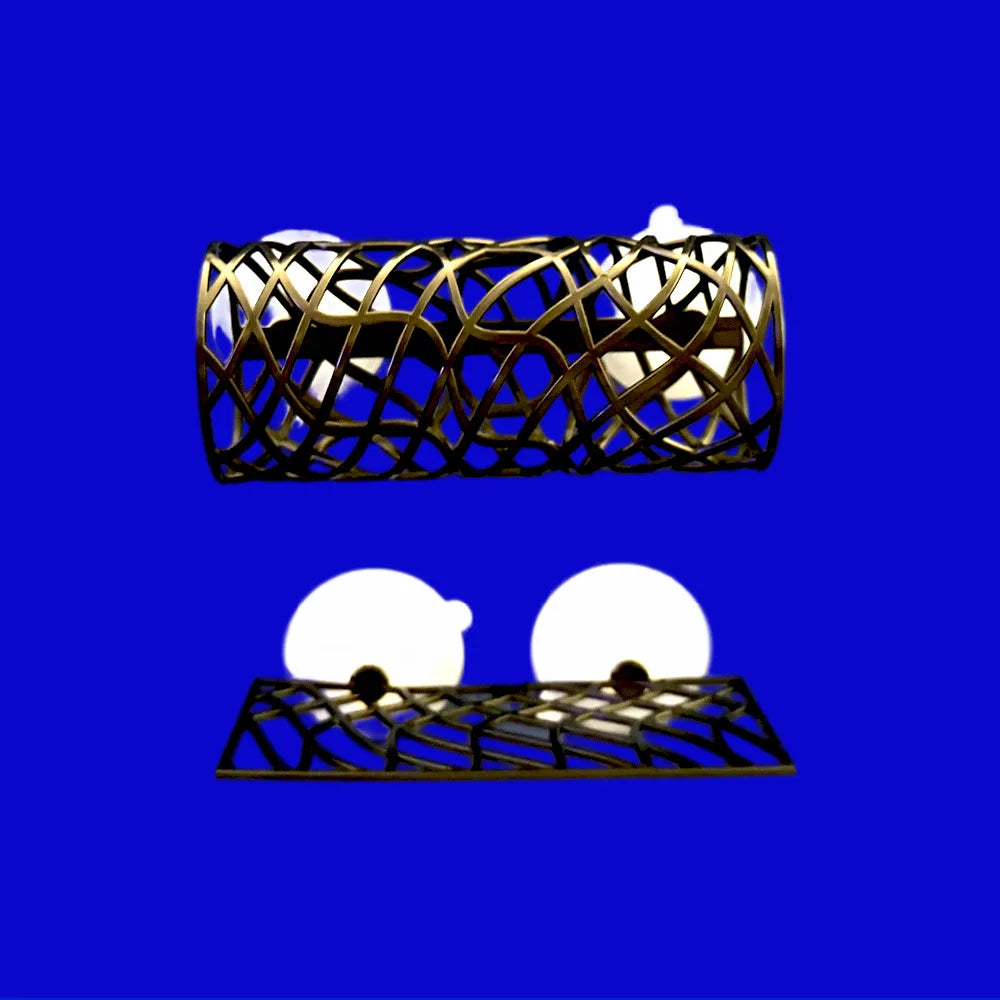 A golden, intricate tunnel hideout structure for fish and shrimp against a blue background.