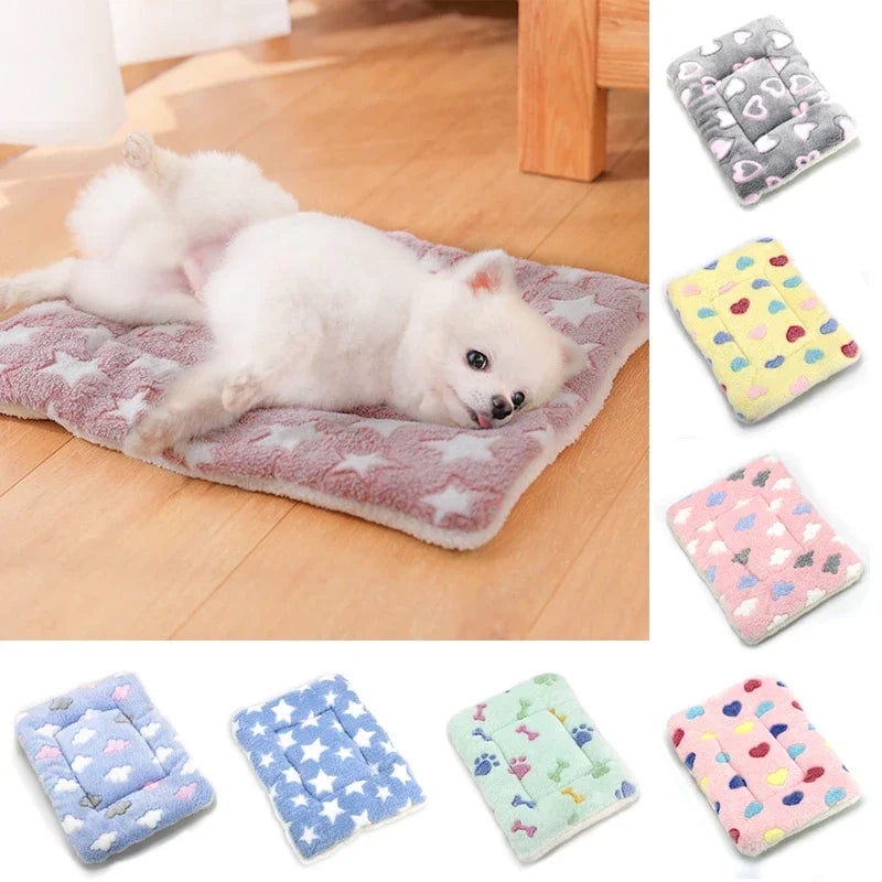 Various patterned plush fleece pet blankets and mats for dogs and cats shown in different colors