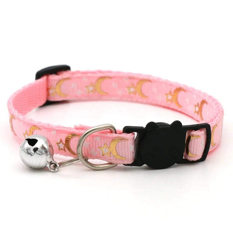 Pink adjustable pet collar with a black buckle and silver bell necklace