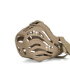 A beige adjustable breathable dog muzzle is shown from above, highlighting its flexible design.