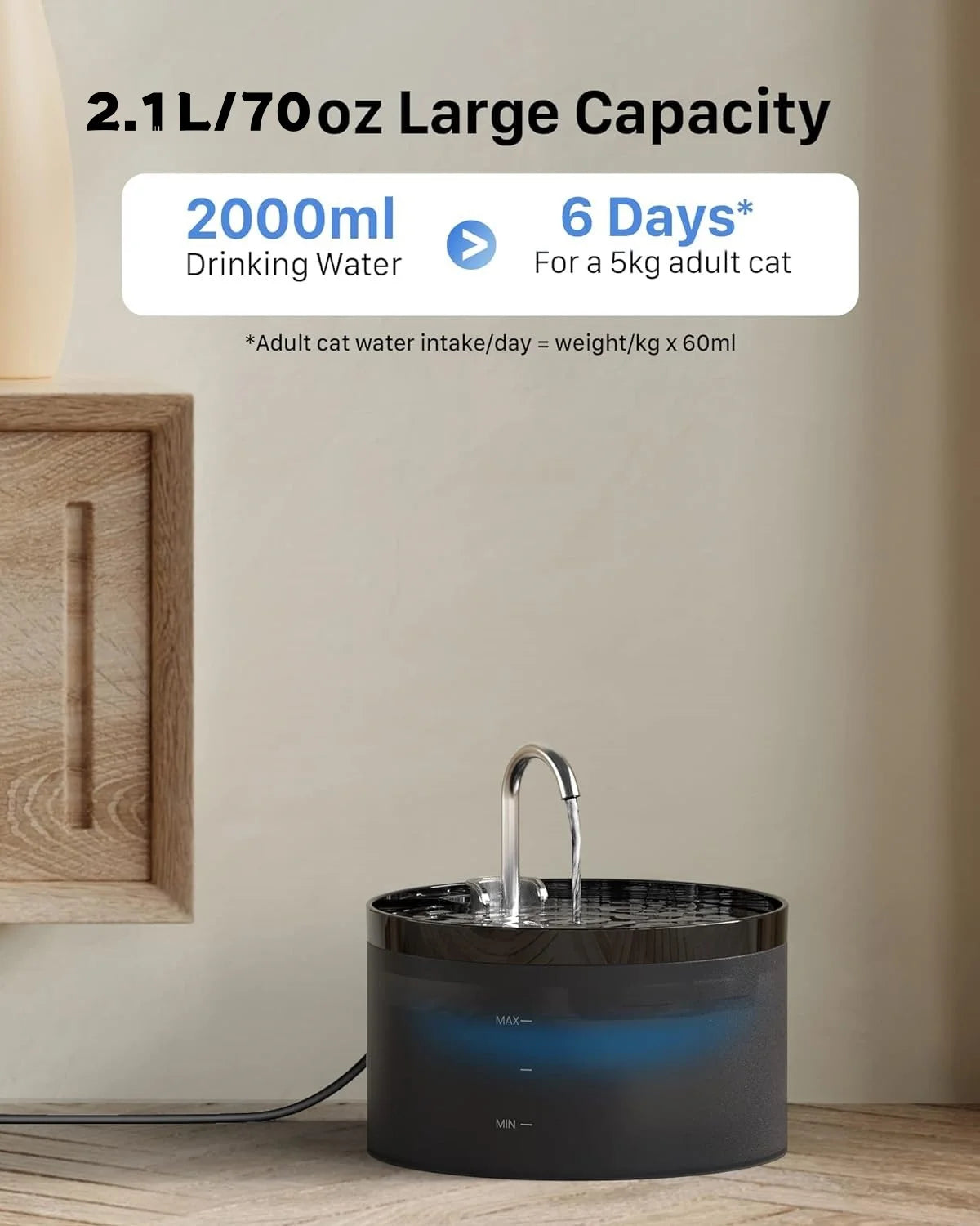 A black automatic pet water fountain is shown on a wooden surface.