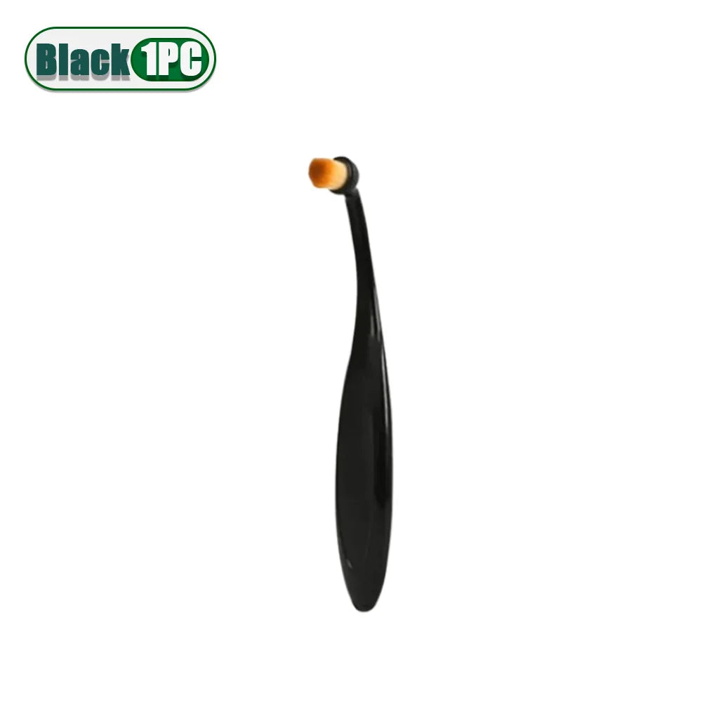 A black pet tear stain remover brush with a yellow tip for cleaning pets.