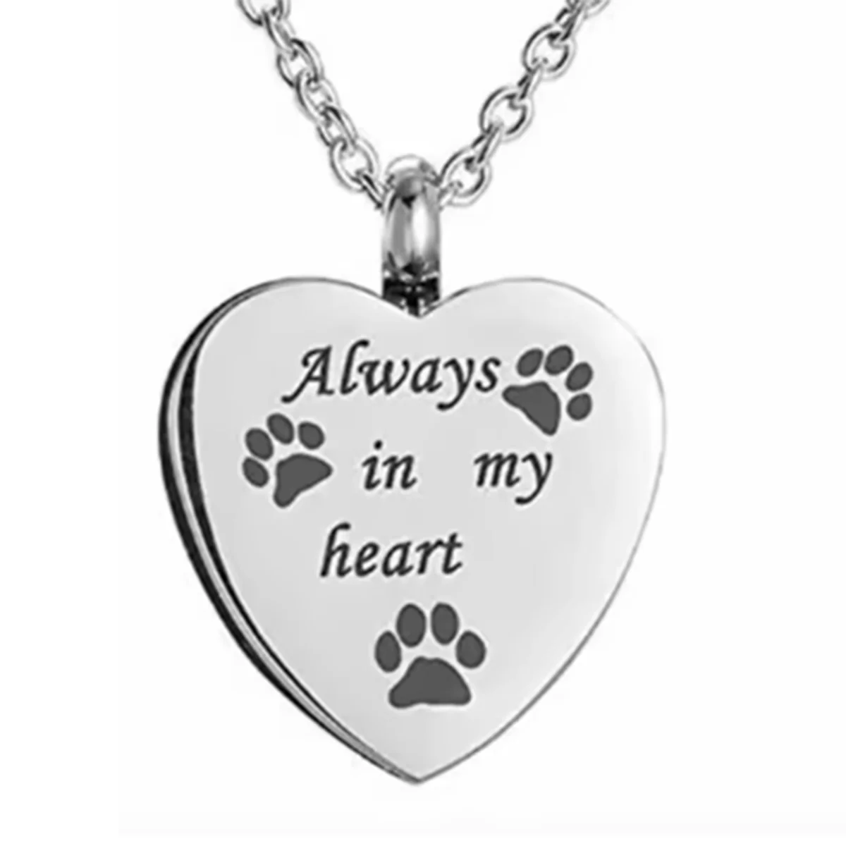 A silver heart-shaped stainless steel necklace with paw prints engraved on it.