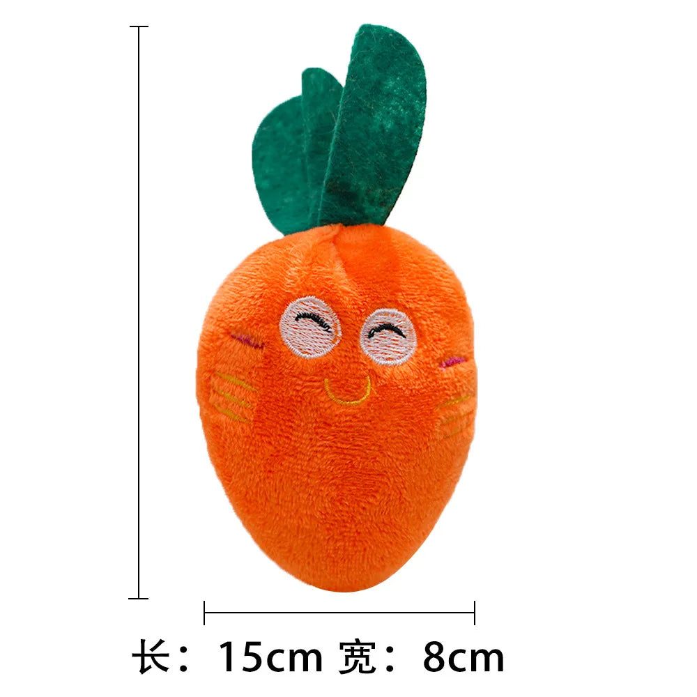 An orange plush toy shaped like a carrot with green leaves, measuring 15cm long and 8cm wide.